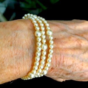 Creamy white pearls used for this triple wrap bracelet/over the head necklace.